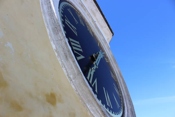 istock Clock chimes on the building, roman dial, time 1306293519
