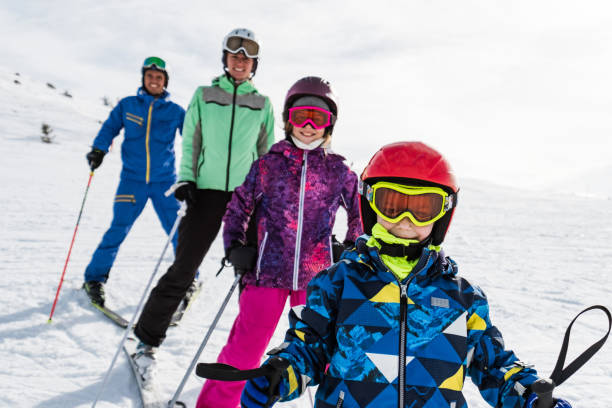 istock Boy and his family on ski vacation 1306294494