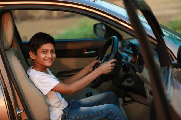 istock Cute Indian child in car 1306301839