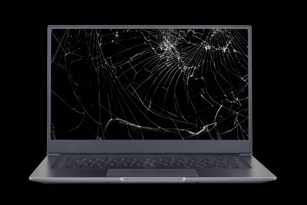 istock laptop with a broken, cracked screen isolated on black background close up front view 1306305684