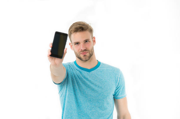 Check out new app. Guy bearded smartphone user. Guy shows you smartphone screen copy space. Man satisfied user recommends try application for smartphone. Man takes advantages online communication.