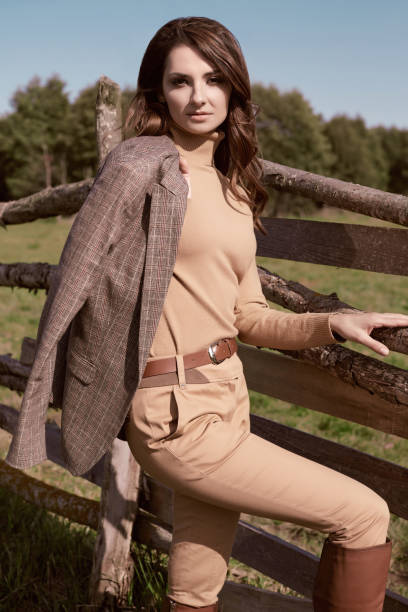 istock Gorgeous brunette woman in an elegant checkered brown jacket 1306307101