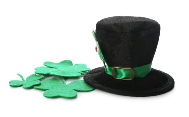 istock Leprechaun's hat and decorative clover leaves on white background. St. Patrick's day celebration 1306307276