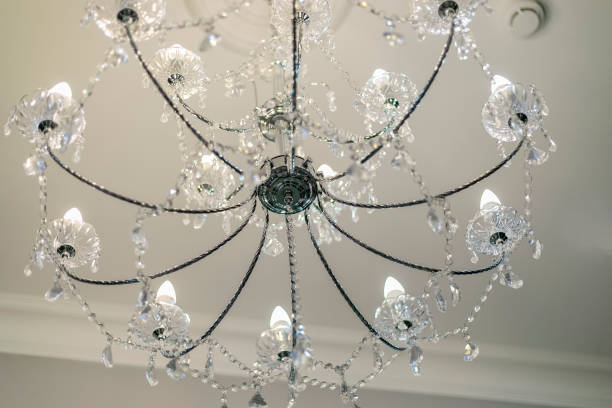 istock Luxurious crystal chandelier, candle-shaped lamps. 1306307397