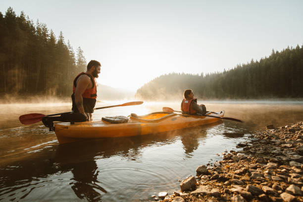 istock Young couple ready for adventures with kayak. 1306308980