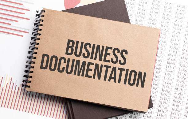 istock Notepad with text BUSINESS DOCUMENTATION on a charts and numbers. Business concept. 1306309784