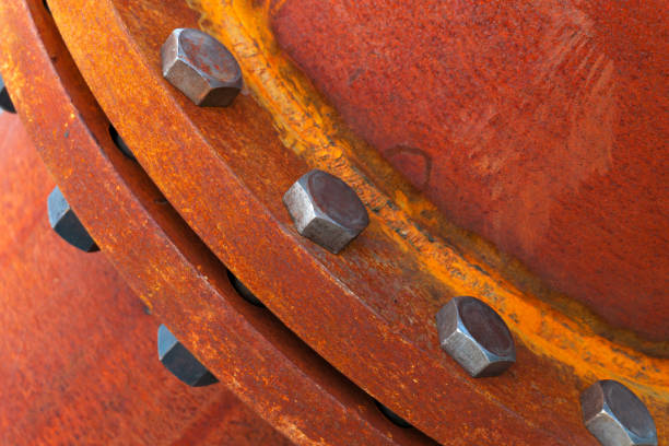 rusted large metal pipe with bolted connection