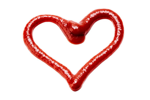 istock ketchup sauce isolated on white background. tomato sauce cut out. design element. studio shot. heart symbol 1306312581