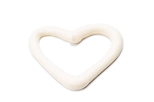 istock mayonnaise sauce isolated on white background. mayo paste cut out. heart shape 1306312586