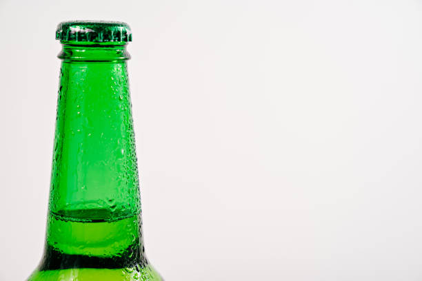 istock green glass bottle covered with water drops. condensate 1306316034