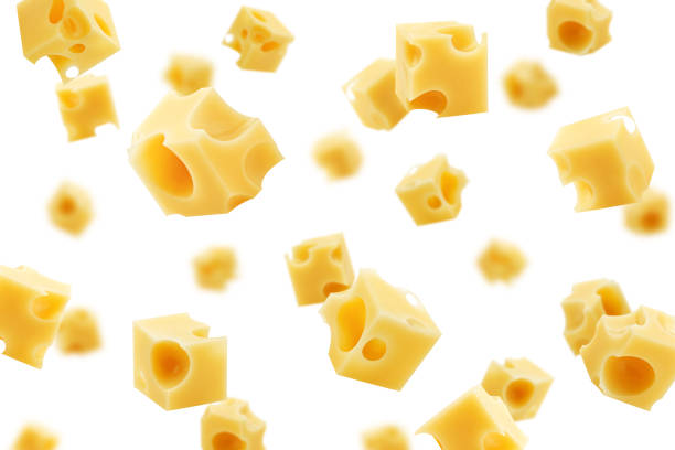 白い背景に隔離された、選択的な焦点の下に置くチーズの�立方体 - dutch cheese 写真 ストックフォトと画像