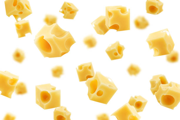 падение сыра куб, изолированные на белом фоне, селективный фокус - dutch cheese фотографии стоковые фото и изображения