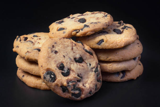 istock Chocolate cookies at black background. 1306320917