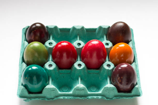 Easter eggs in diferent colours at a white background.