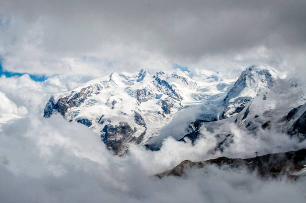 View of Monterosa in Alps, thru clouds.