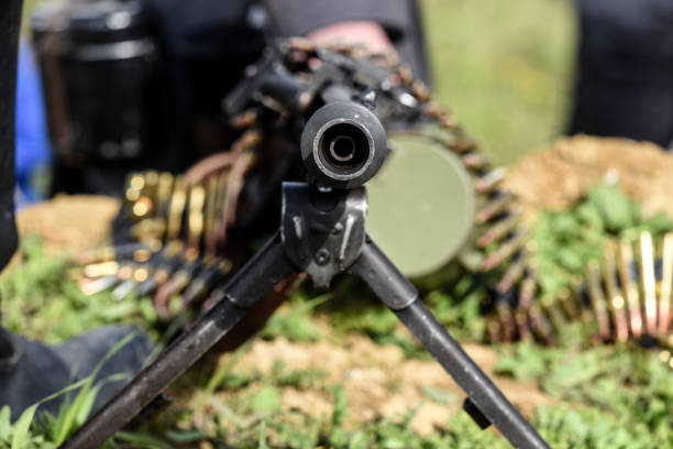 istock A rifle of machine gun with ammunition, outdoor. 1306322507