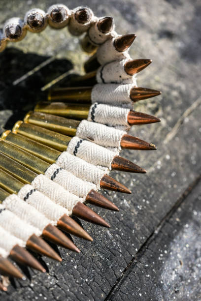 istock Bullets in ammunition belts outdoor for machine gun. 1306322724