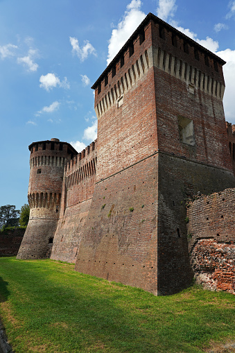 Soncino, Italy - August 18, 2020: Soncino (Cremona, Lombardy) the Sforzesca fortress of Soncino seen from the external perimeter. It was built in the 10th century, and it was active since the years around 1500.