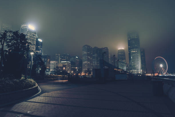 istock Modern office buildings in Hong Kong at night time 1306323169
