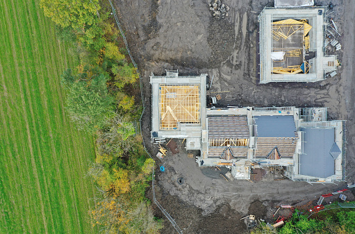 House development construction site in progress aerial view UK