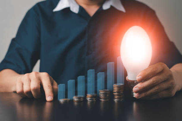 istock A man with money coin and graph computer graphic light 1306327601
