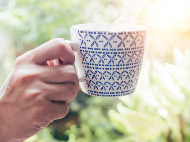 istock Hand hold Asian Blue and White Vintage Mugs 1306328551
