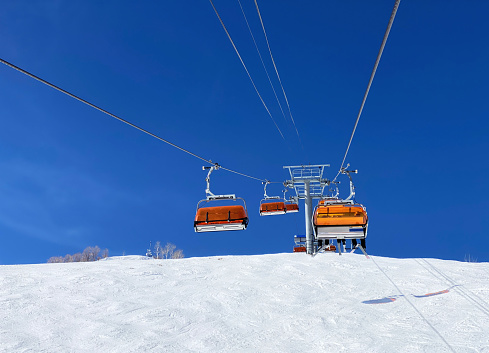 Chairlift against blue ski Park City Utah ski resort
