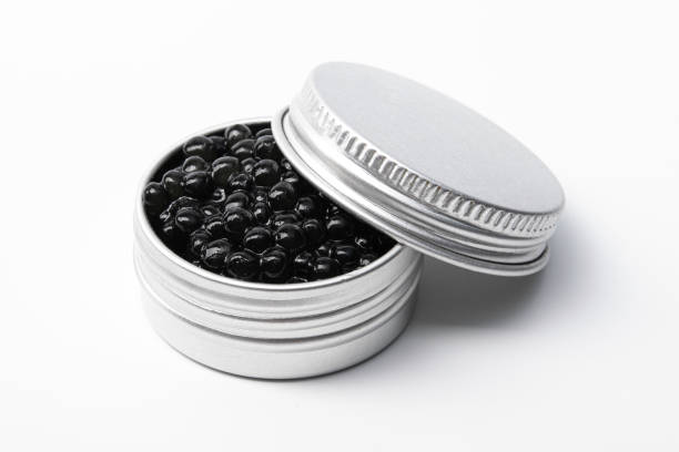 istock Black caviar in metal container isolated 1306329441