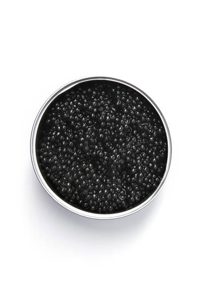 istock Black caviar in metal container isolated 1306329452