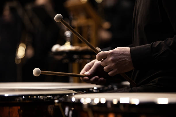 Hands of a musician playing the timpani