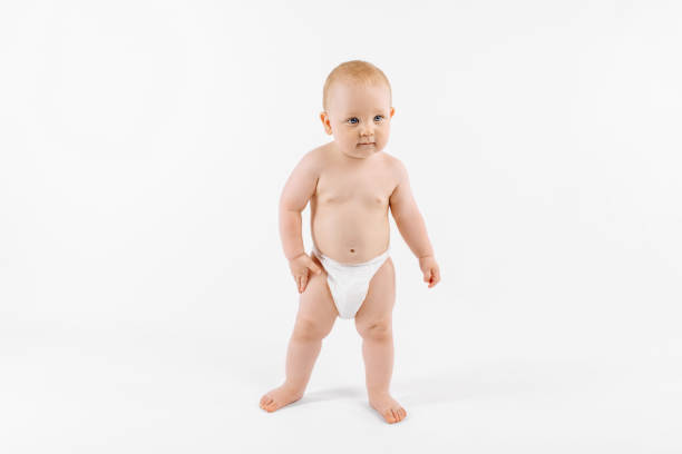 istock Standing little boy isolated on white background 1306334736