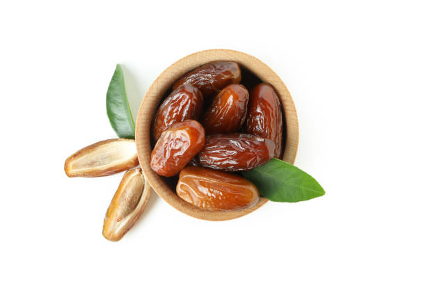 istock Bowl with dried dates isolated on white background 1306335186