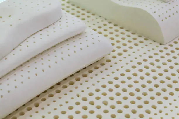 Industrial production close up shot with latex mattress filling material samples.