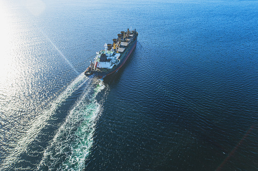 Aerial view of a gypsum freighter nearing port.