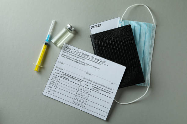 istock Concept of Covid - 19 vaccination on gray background 1306338725