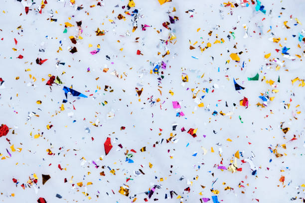 istock Colorful Confetti on white snow background, close-up. 1306340169
