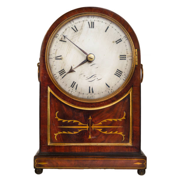 istock Wooden ancient clock isolated on white 1306341546