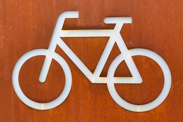 istock White bicycle sign on a corten steel rusted background 1306341591