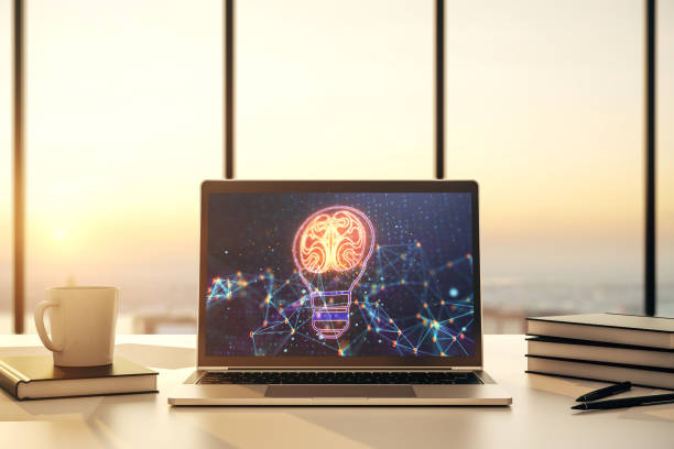 istock Modern computer monitor with creative light bulb hologram with human brain, idea and brainstorming concept. 3D Rendering 1306342115