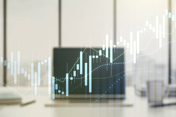 istock Abstract creative financial graph on modern laptop background, financial and trading concept. Multiexposure 1306342125