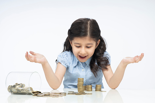 Child girl, cute, Currency, coins, Savings, childhood, India, Indian ethnicity,