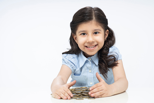 Child girl, cute, Currency, coins, Savings, childhood, India, Indian ethnicity,