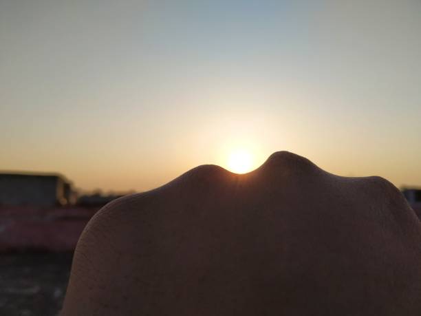 istock Beautiful morning sunrise between the human punch 1306343709