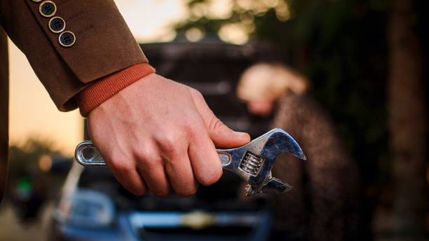 istock Dramatic scene for a man carrying a wrench 1306343795