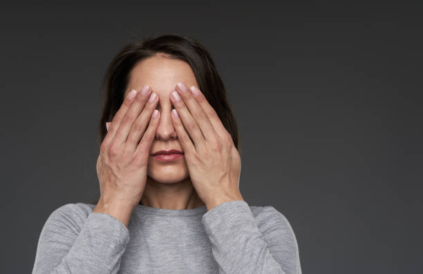 istock Woman covering her face 1306344333