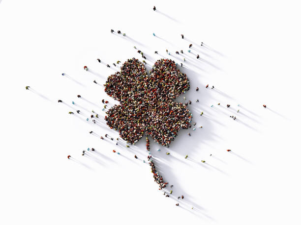 Luck And Opportunity Concept - Human Crowd Forming A Four Leaf Clover Symbol: Luck Concept