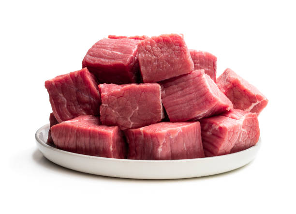 istock Fresh raw beef in ceramic plate isolated on white 1306344944