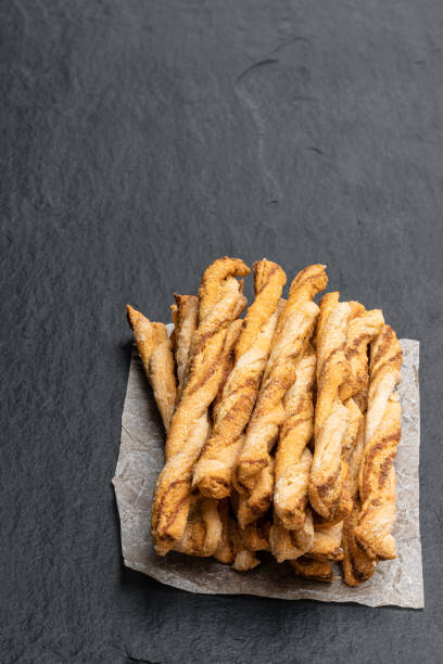 istock Spicy puff pastry twists isolated on white 1306345594