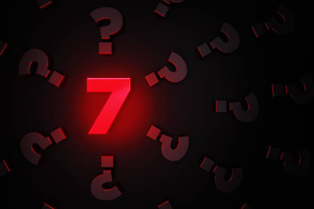 istock Q And A Concept - Red Number Seven Glowing Amid Black Question Mark Symbols On Black Background 1306346331