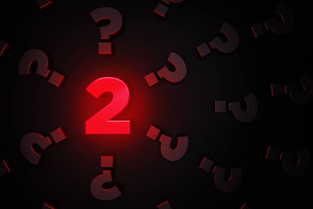 istock Q And A Concept - Red Number Two Glowing Amid Black Question Mark Symbols On Black Background 1306346392